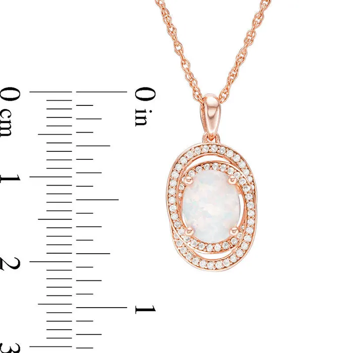 Oval Opal and 025 CT TW Natural Diamond Orbit Frame Pendant in 10K Rose Gold Goldia Necklaces Oval Opal and 025 CT TW Natural Diamond Orbit Frame Pendant in 10K Rose Gold Goldia Necklaces